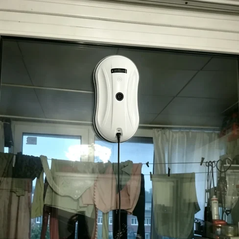 Happy customer showing clean glass results
