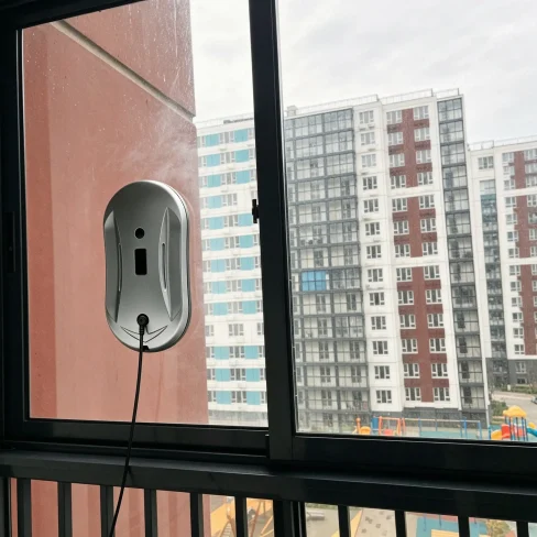 Homeowner using smart window cleaner